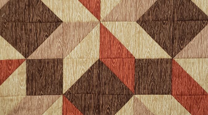 A close up of the quilt pattern
